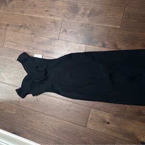 Maeve Elegant Black Midi Dress with small slit in the back